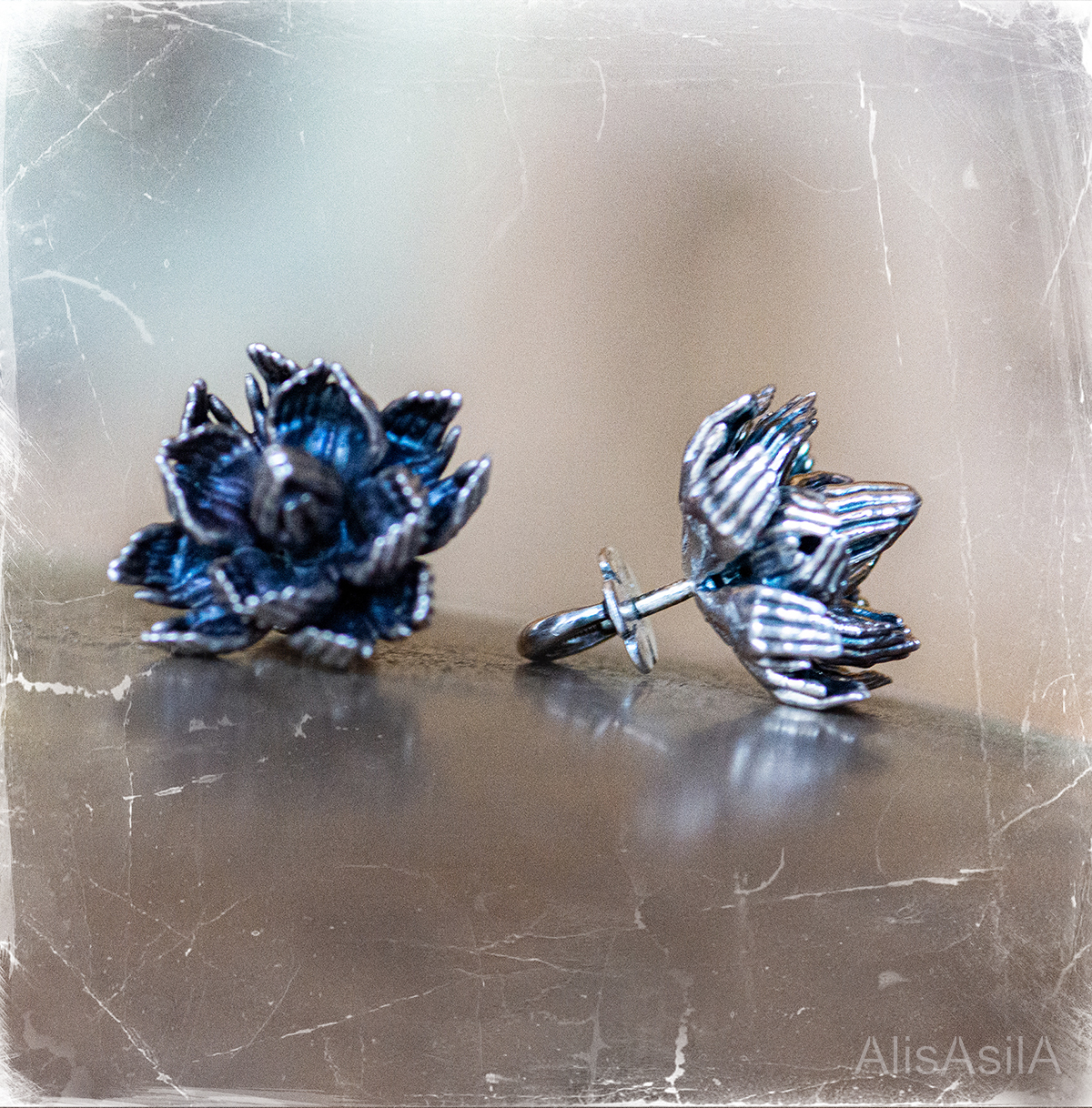 This image content: The earrings of silver; lotus of palms, Ornamental lotuses; the collection of jewelry “Lotus of Unity”, magical lotuses, jewelry by Alisa Skvortsova;