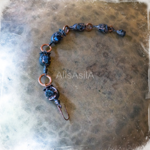 This content is the image: Electroforming copper poppies: "Goddess dreams" earrings with schorl