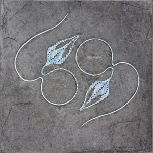 Handcrafted earrings from the HERBARIUM collection, featuring organic shapes and earthy tones inspired by nature